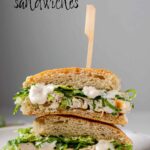 A stacked, halved sandwich with the text chicken casesar sandwiches.