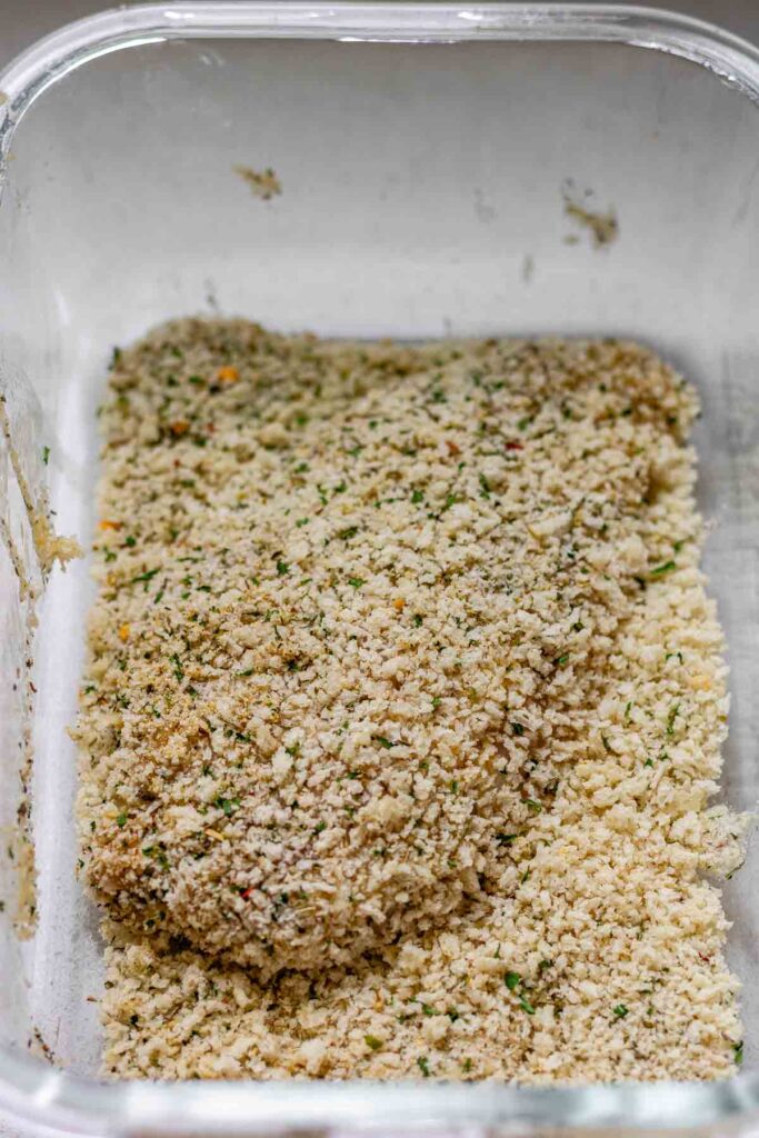 A chicken breast coated in breadcrumbs.