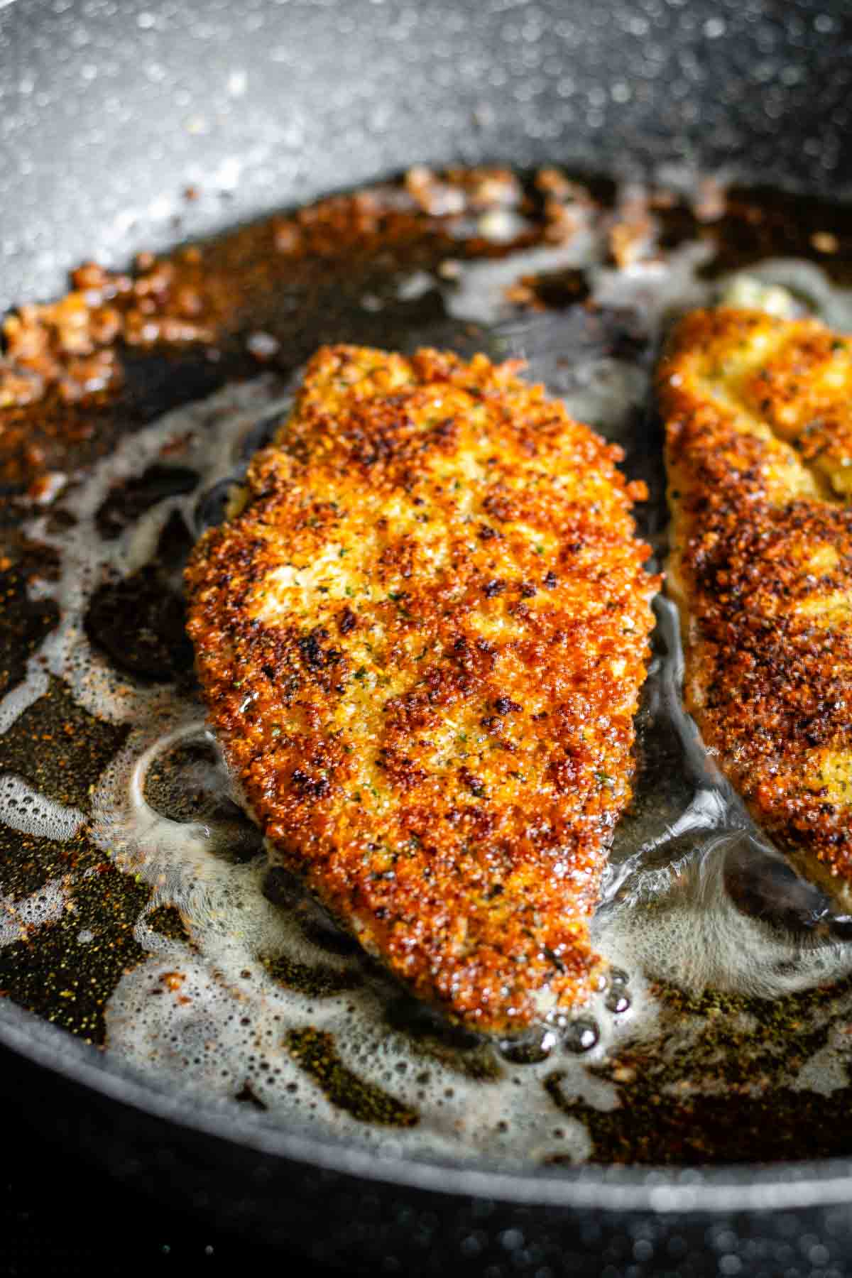 Fried chicken coated in breadcrumbs.