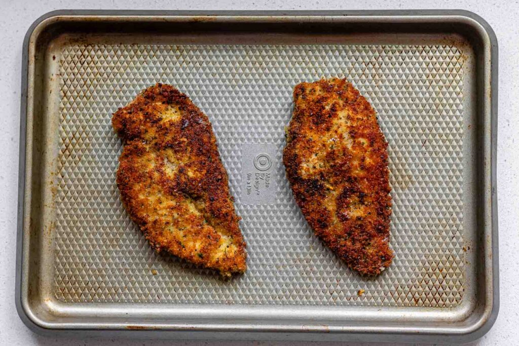 Fried chicken coated in breadcrumbs.