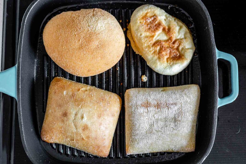 Buns toasting in a grill pan.