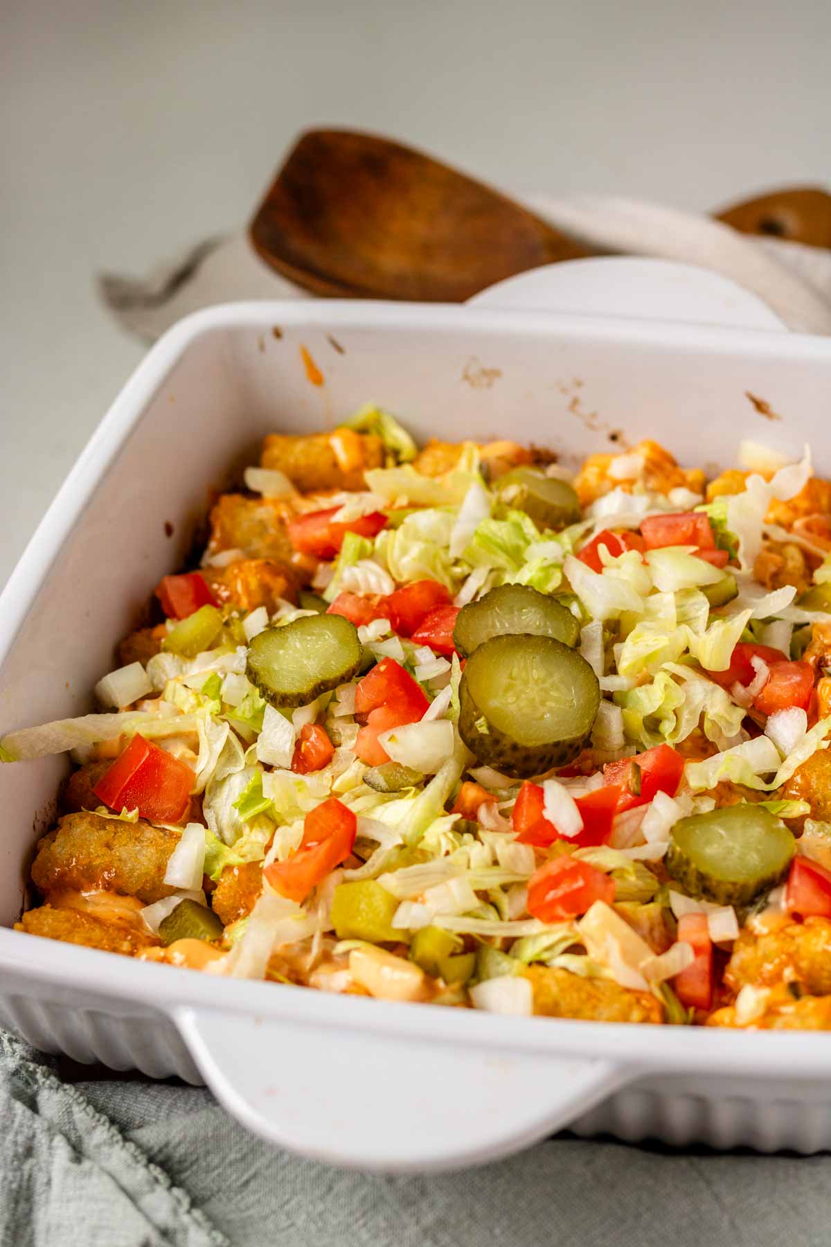Big Mac tater tot casserole in a white baking dish.
