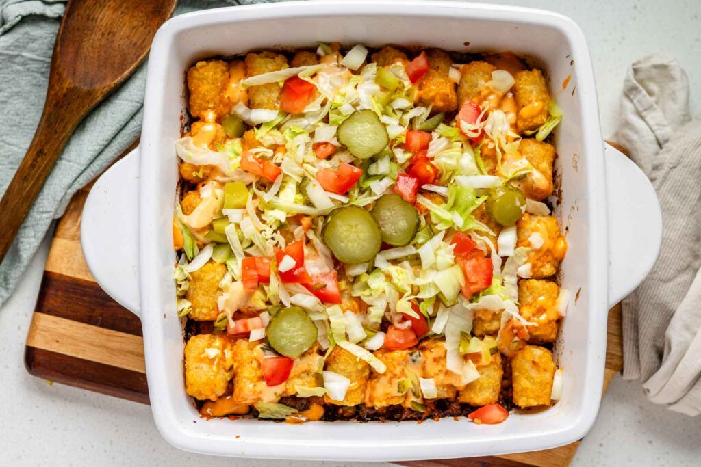 Big Mac tater tot casserole in a white baking dish.