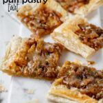 Puff pastry squares topped with caramelized onions and melted cheese with the text onion puff pastry tart.