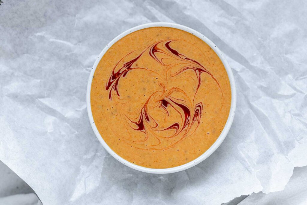 Orange sauce in a bowl.