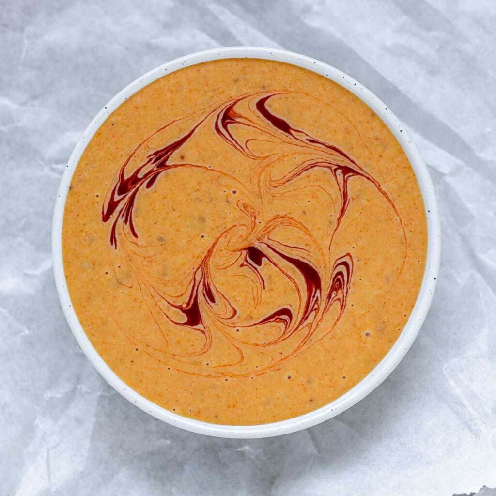 Orange sauce in a bowl.