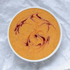 Orange sauce in a bowl.