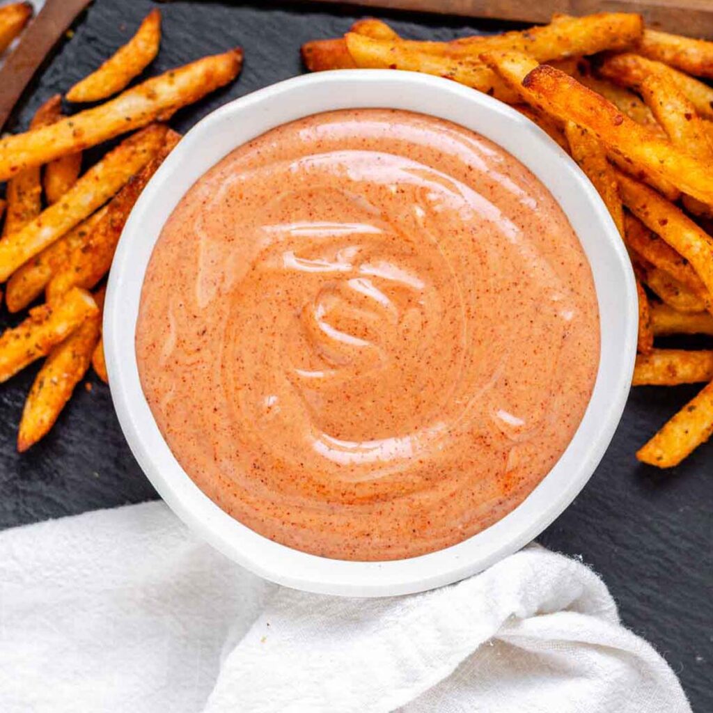 Orange sauce in a bowl.